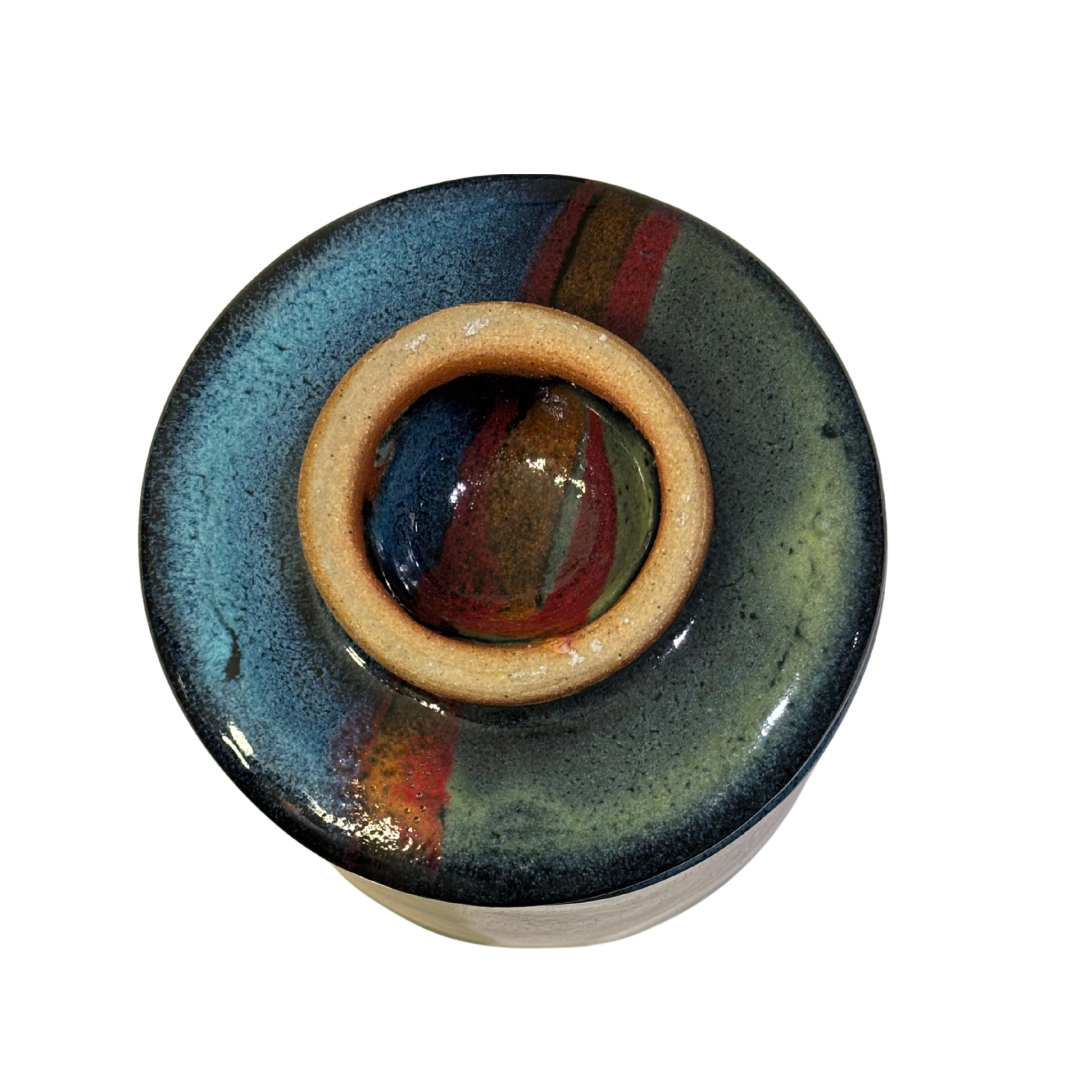 Handmade ceramic French butter press in Artic Twilight glaze with deep blue, red, and earthy tones.
