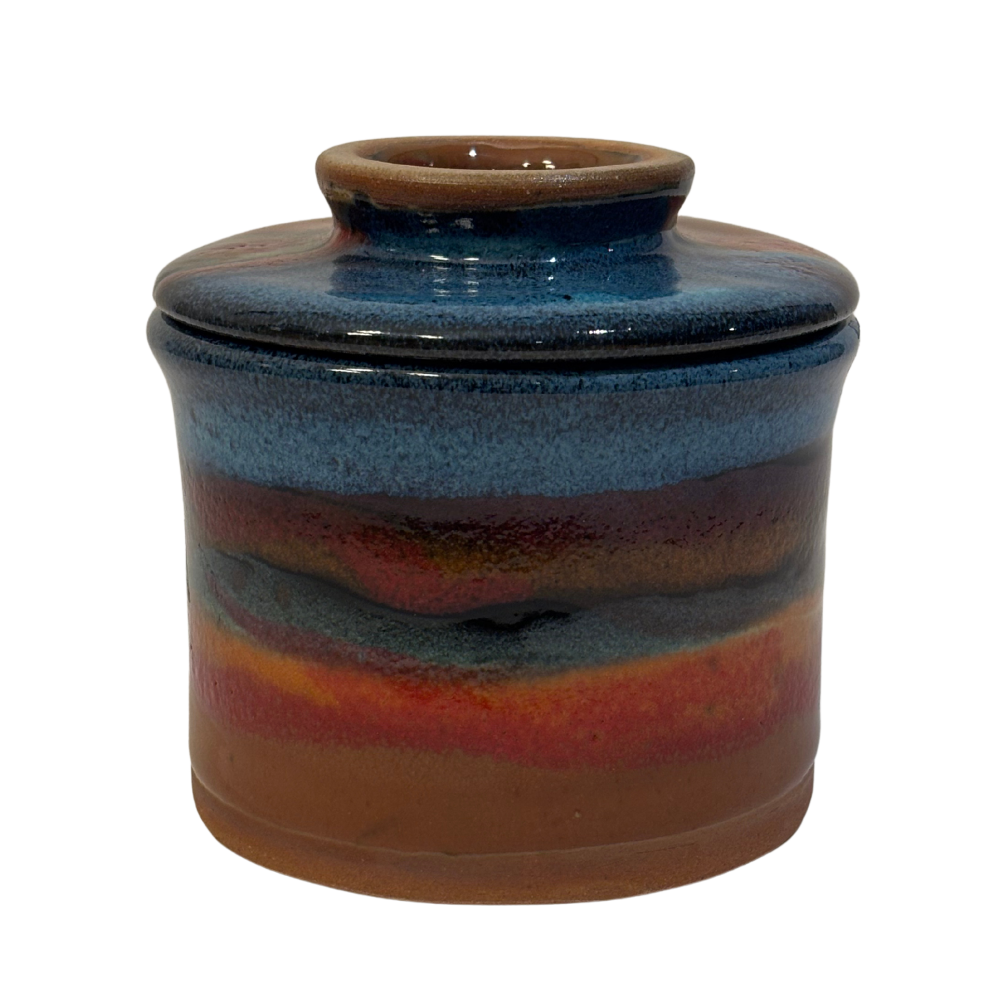 Handmade ceramic French butter press in ruins glaze with blue, red, and earthy brown tones