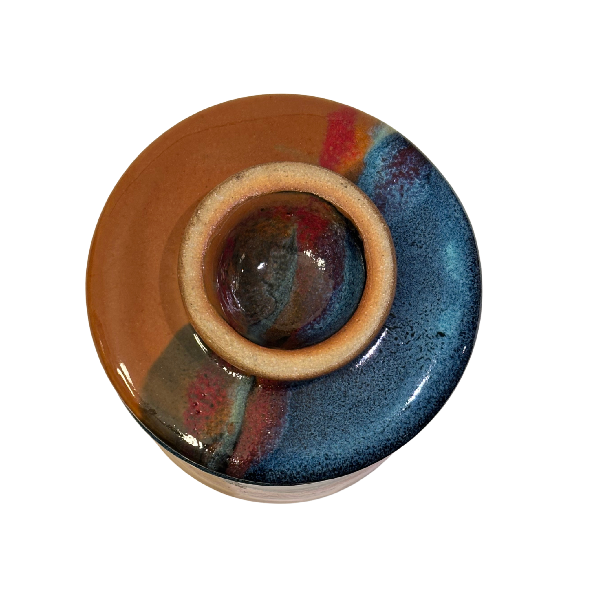 Handmade ceramic French butter press in ruins glaze with blue, red, and earthy brown tones