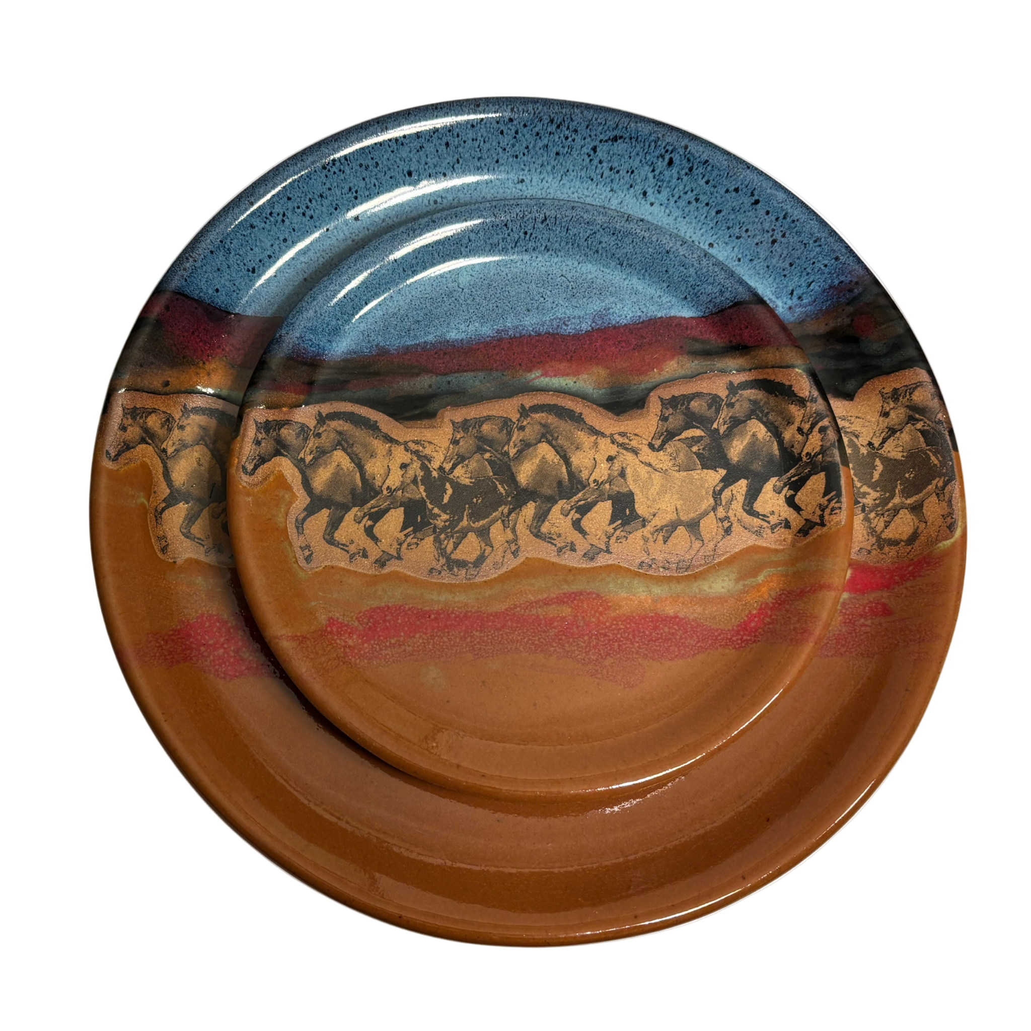 Handmade ceramic dinner and salad plates with running horse artwork and layered desert glaze.