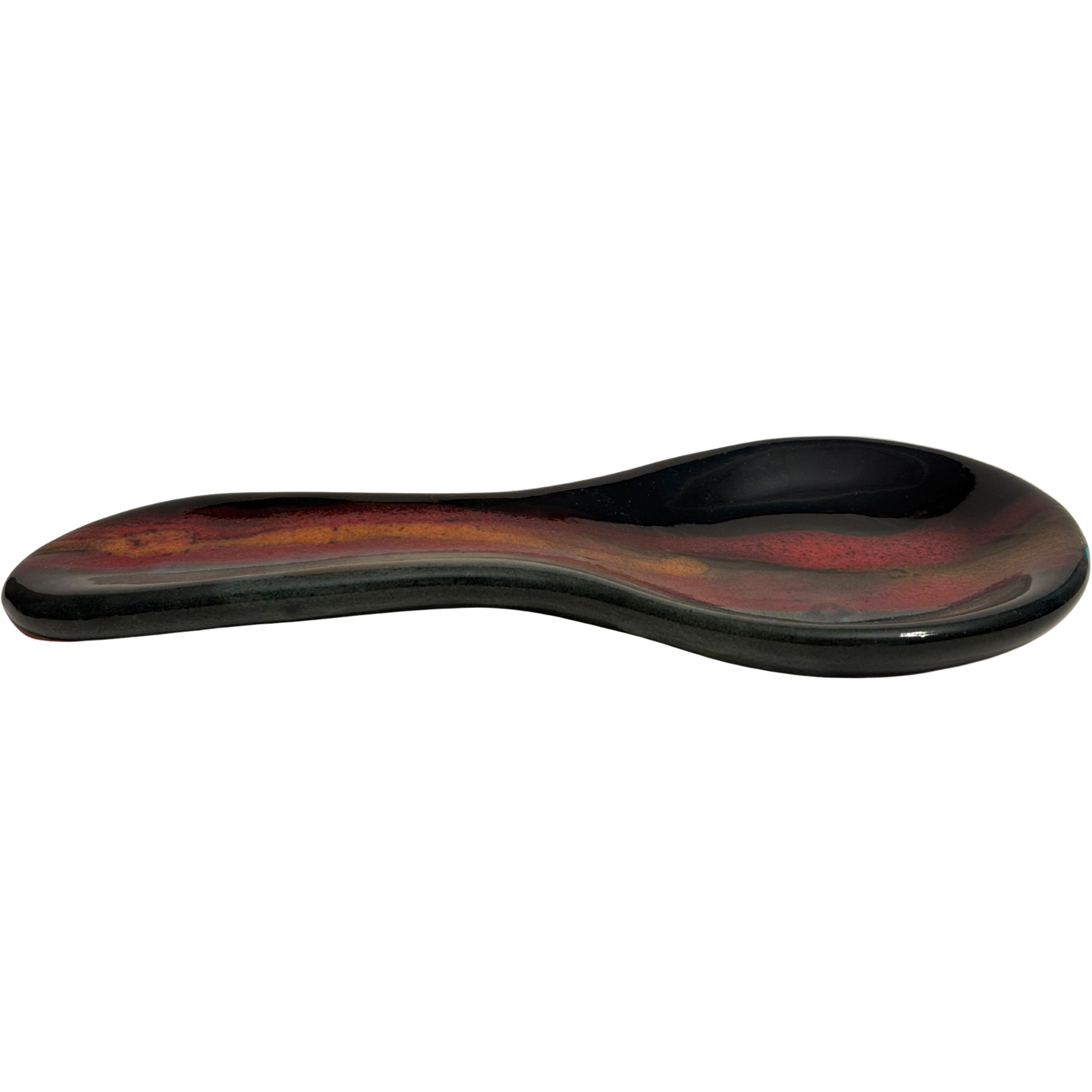Handmade Jasper Wilderness ceramic spoon rest for kitchen counters, with black glaze, earthy red, and golden tones inspired by mountain sunsets.