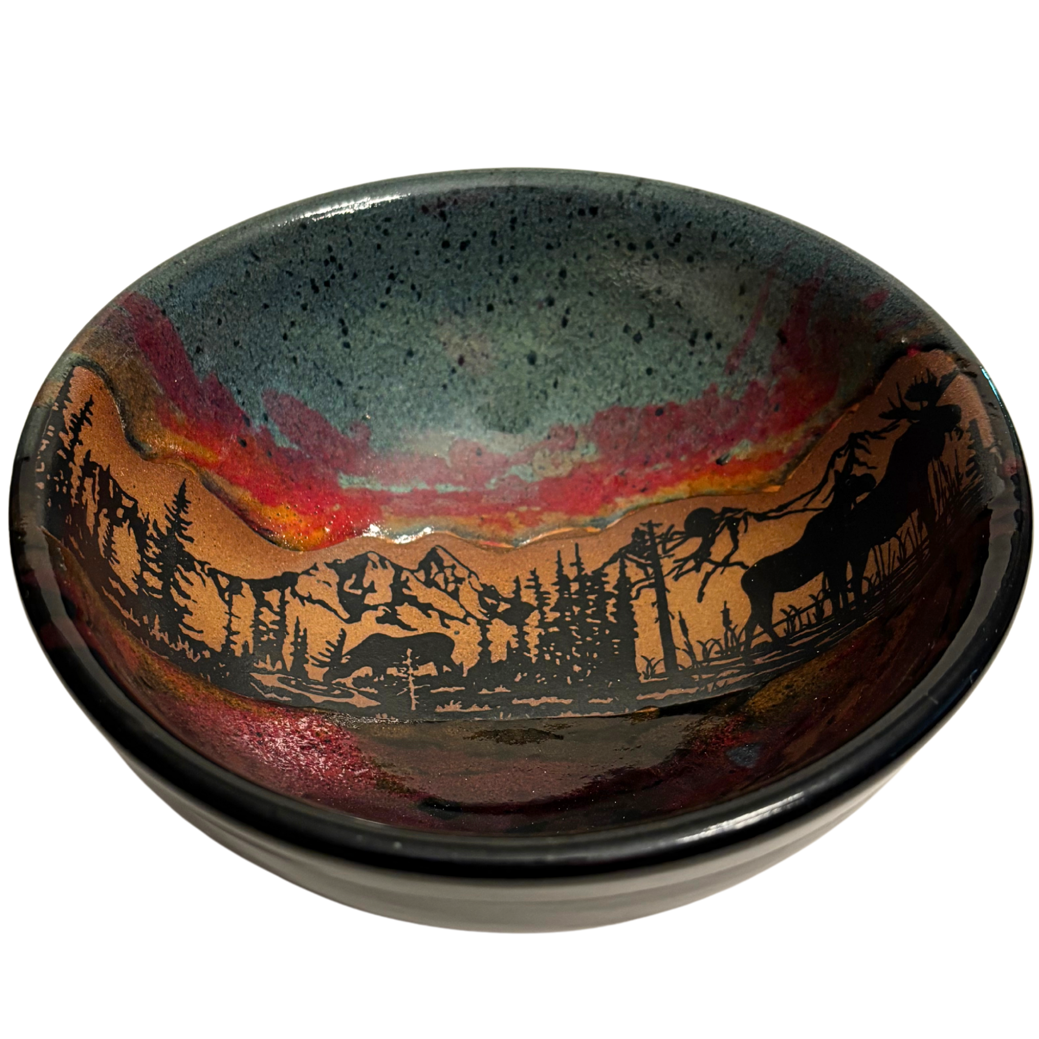 Jasper Wilderness handmade ceramic salad bowl with green and red glaze featuring elk and mountain forest silhouette design.