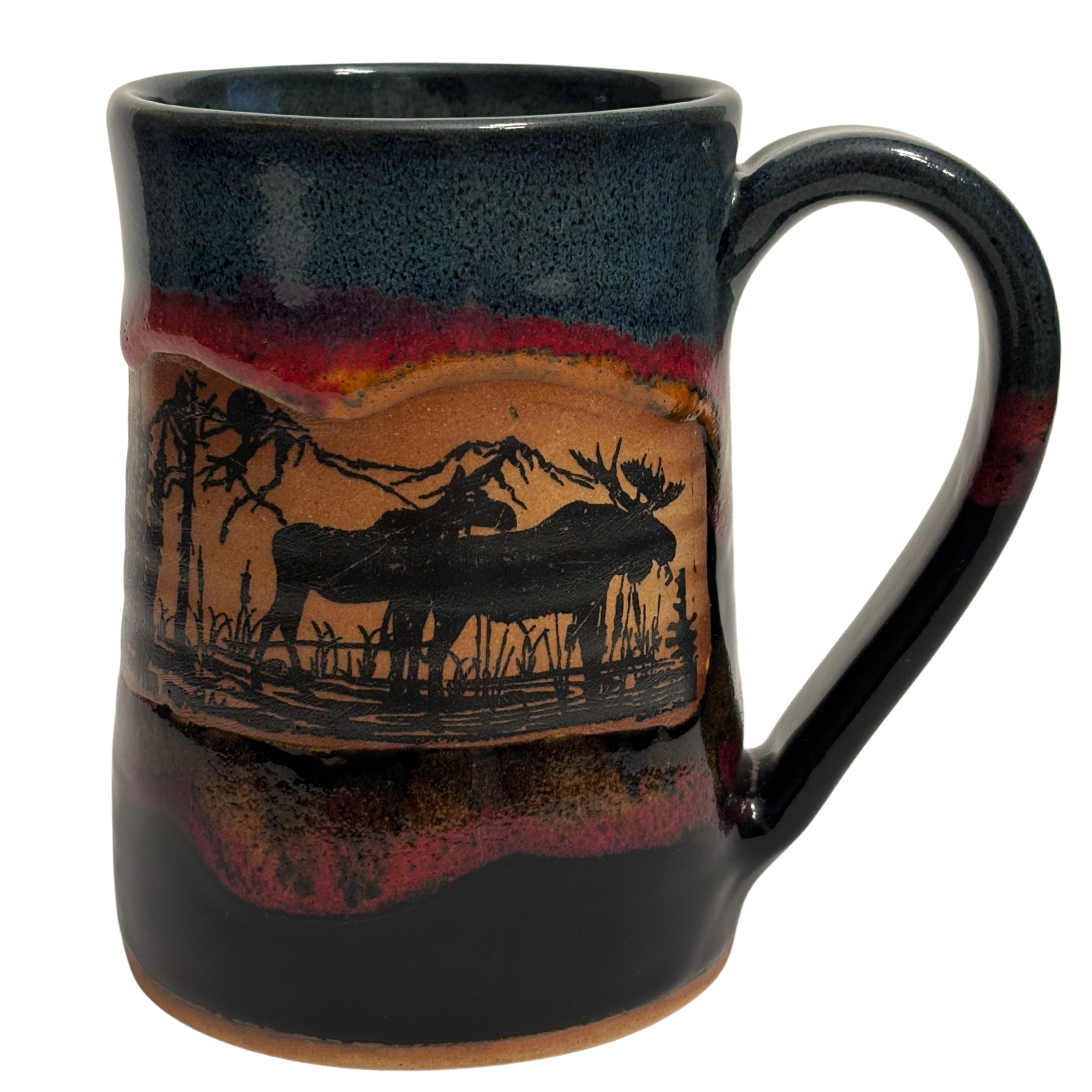 Jasper Wilderness handmade ceramic tankard with deep blue and red glaze featuring elk and forest silhouette design.