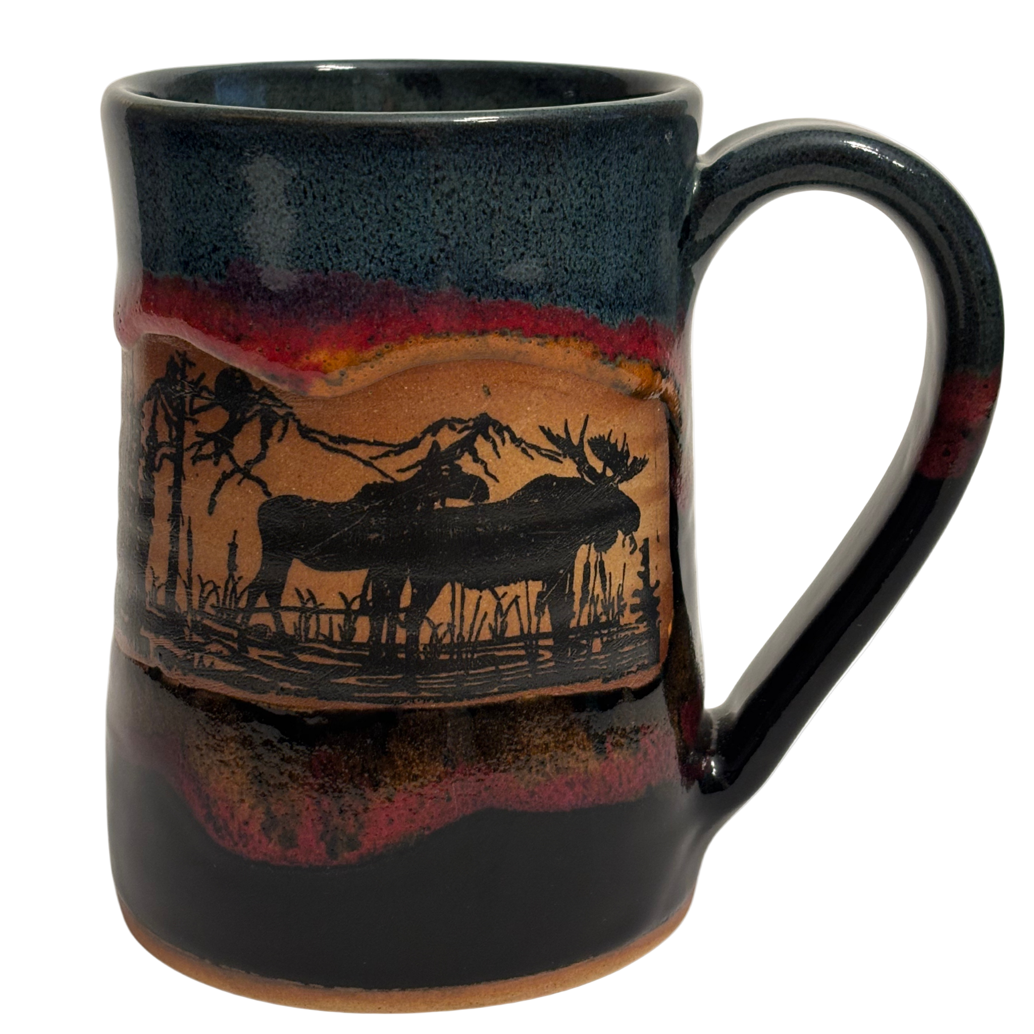 Jasper Wilderness handmade ceramic tankard with deep blue and red glaze featuring elk and forest silhouette design.