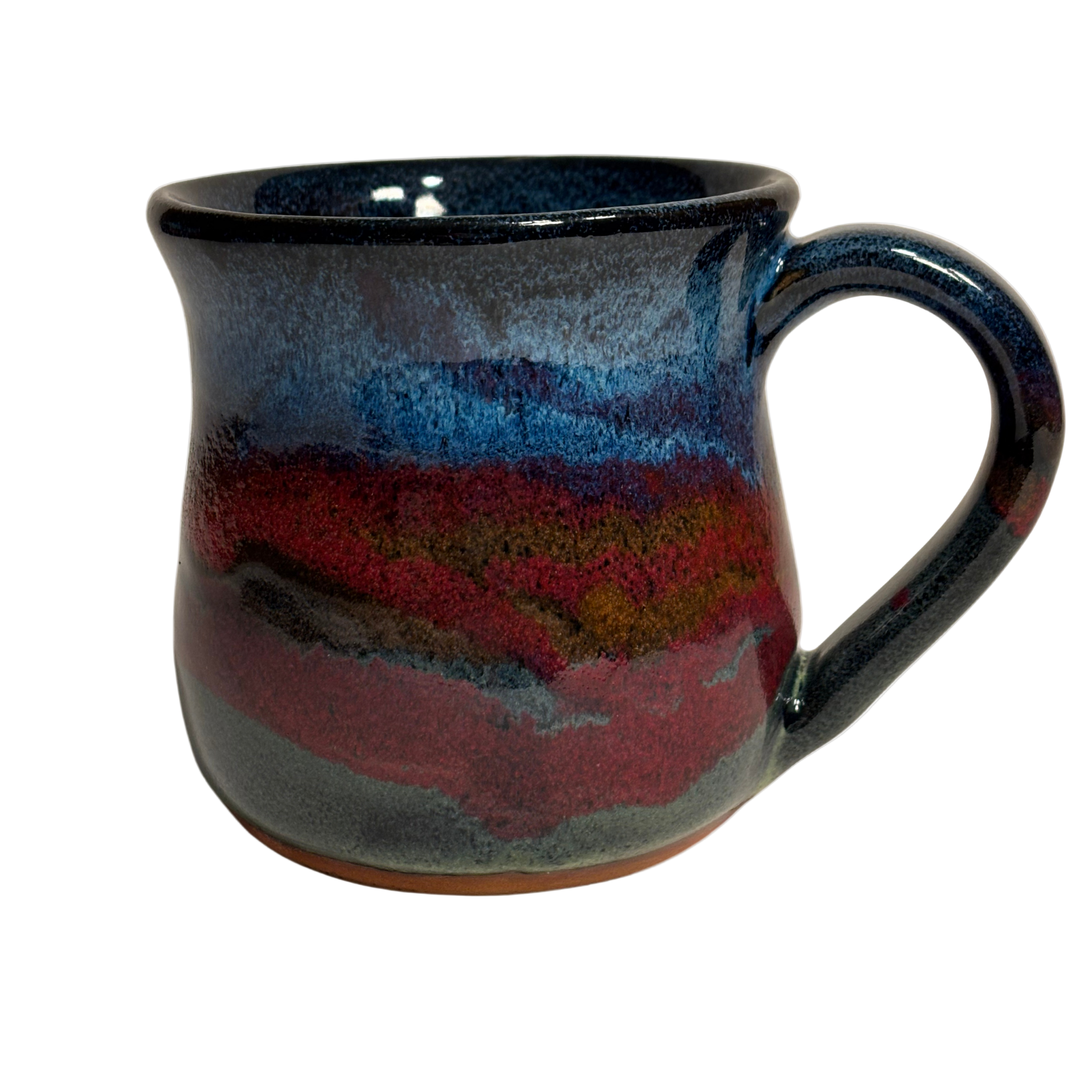 Handmade ceramic mug with deep mountain-inspired glaze in red, blue, and charcoal