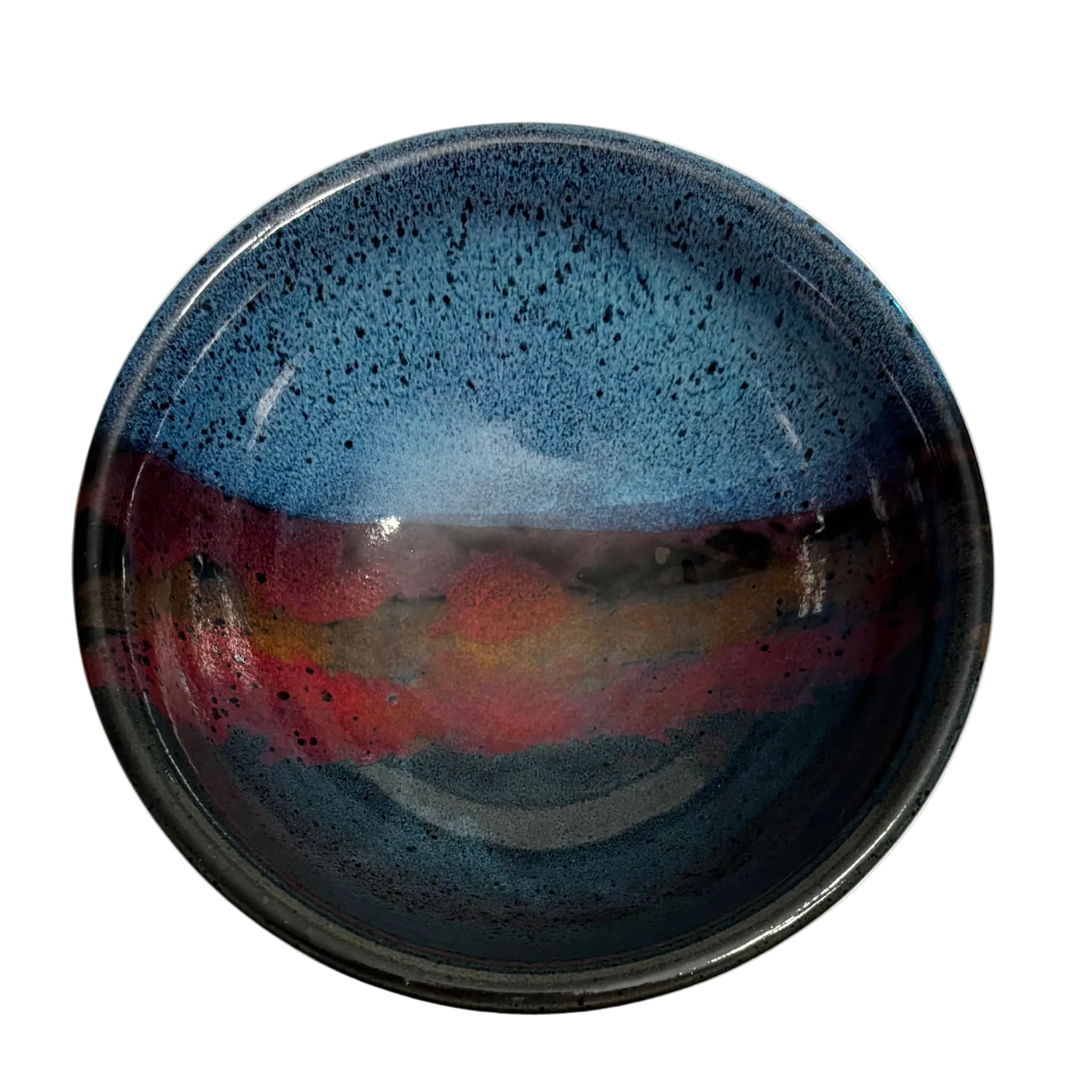 Mountain Dusk handmade ceramic salad bowl with deep blue interior and flowing red, brown, and purple glaze resembling dusk sky.