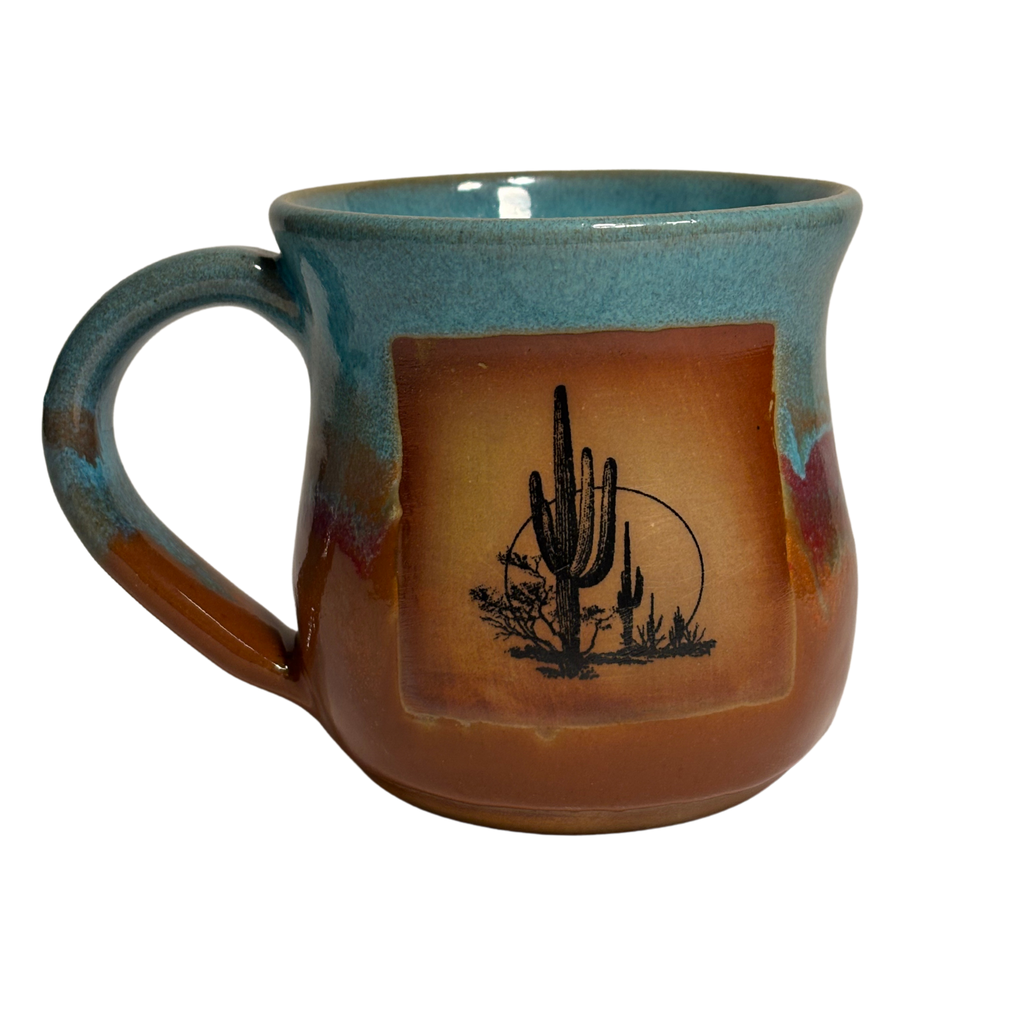 Handmade ceramic mug with turquoise, red, and clay-toned glaze
