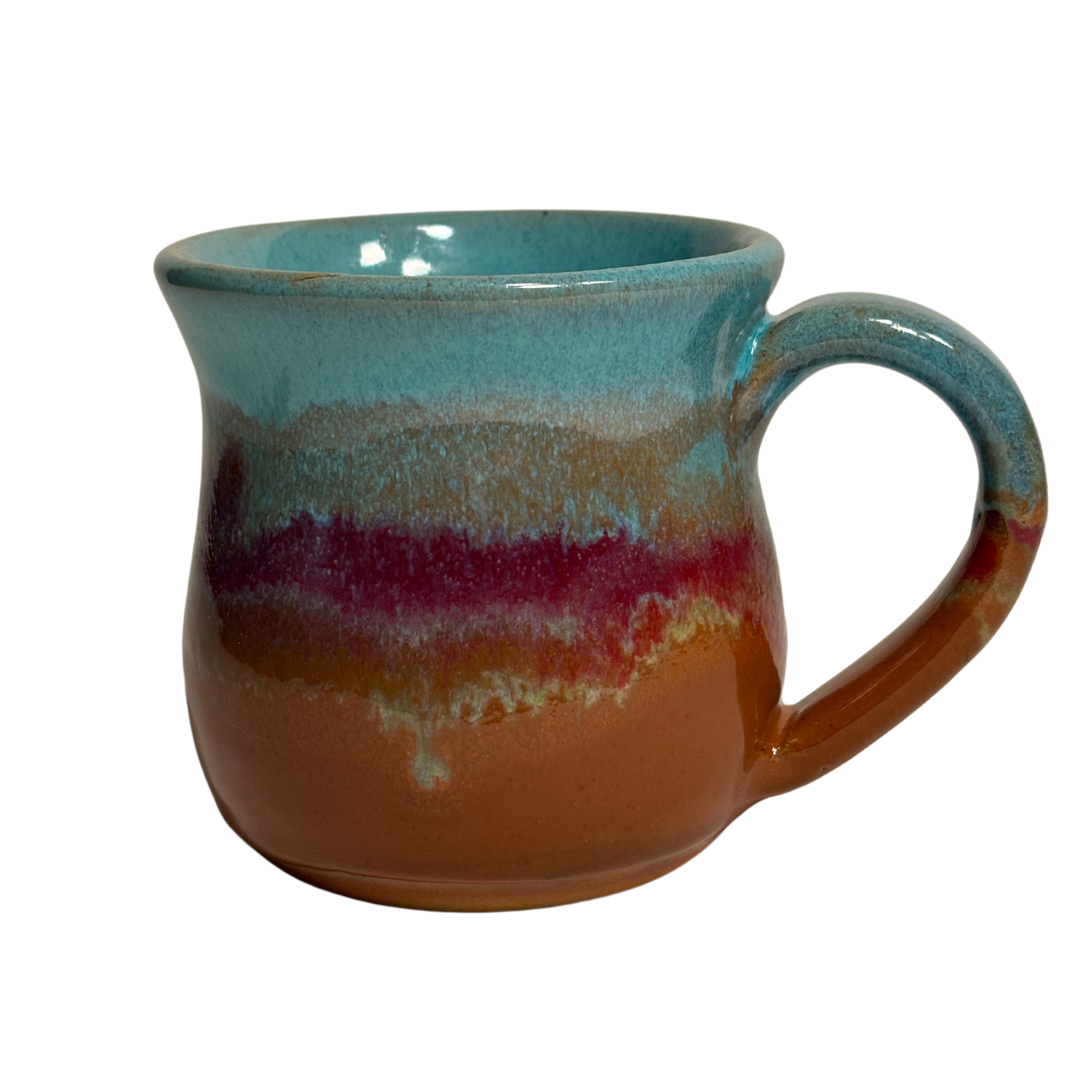 Handmade ceramic mug with turquoise, red, and clay-toned glaze