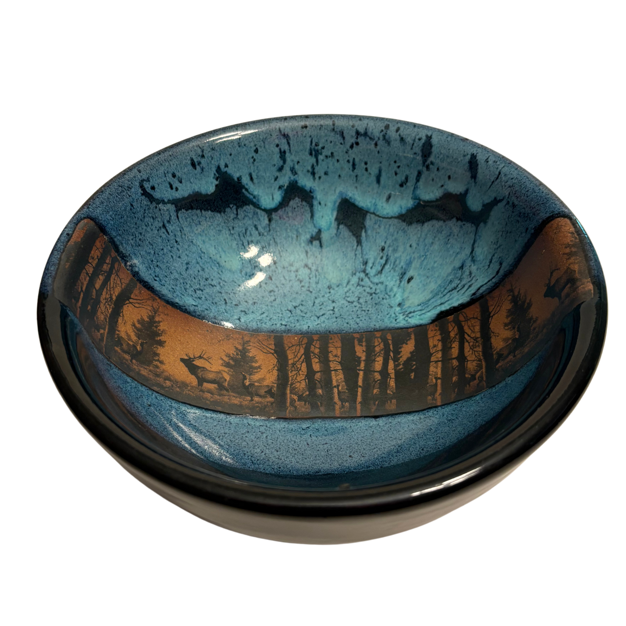 Enchanted Forest handmade ceramic salad bowl with blue glaze and woodland elk silhouette against forest landscape band.