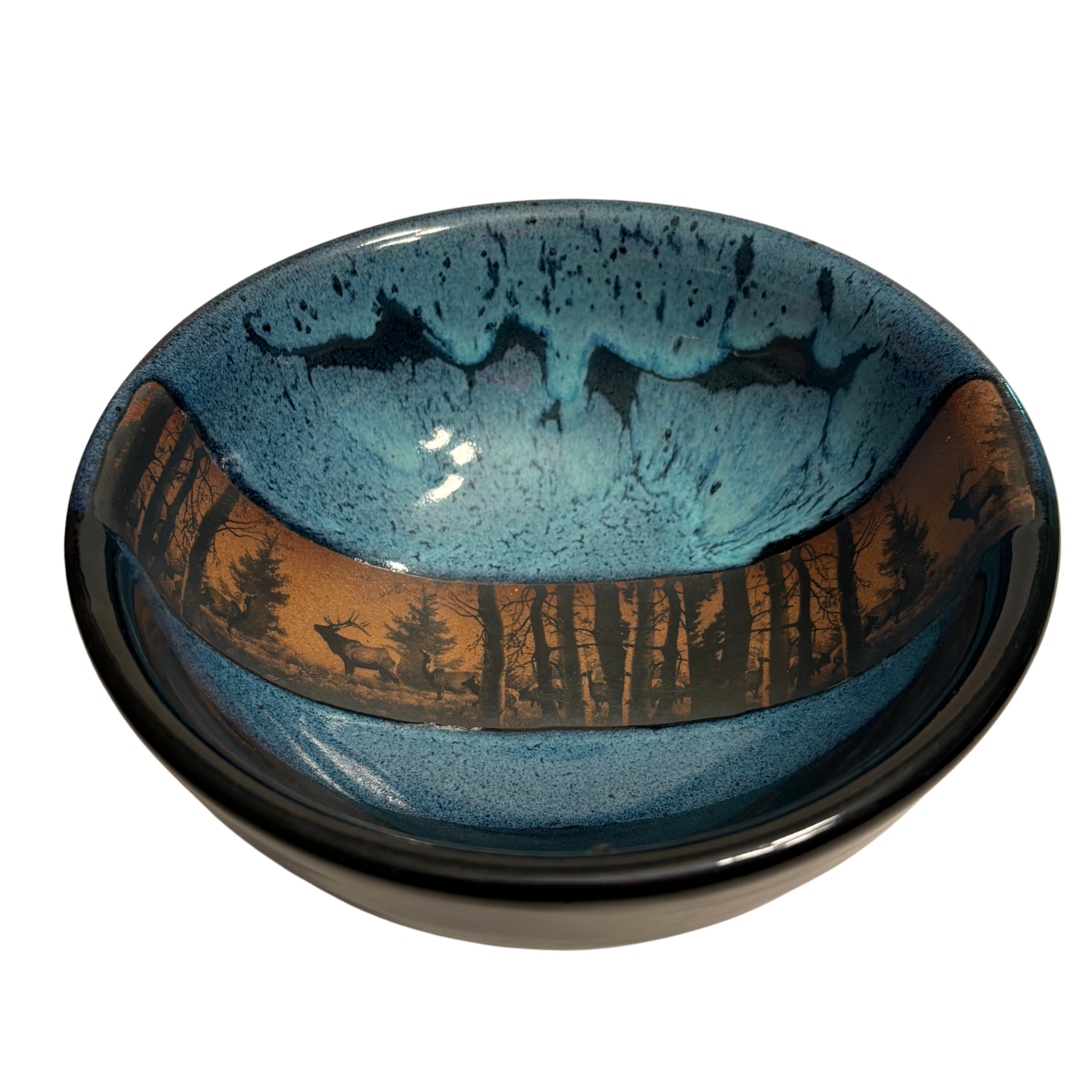 Enchanted Forest handmade ceramic salad bowl with blue glaze and woodland elk silhouette against forest landscape band.