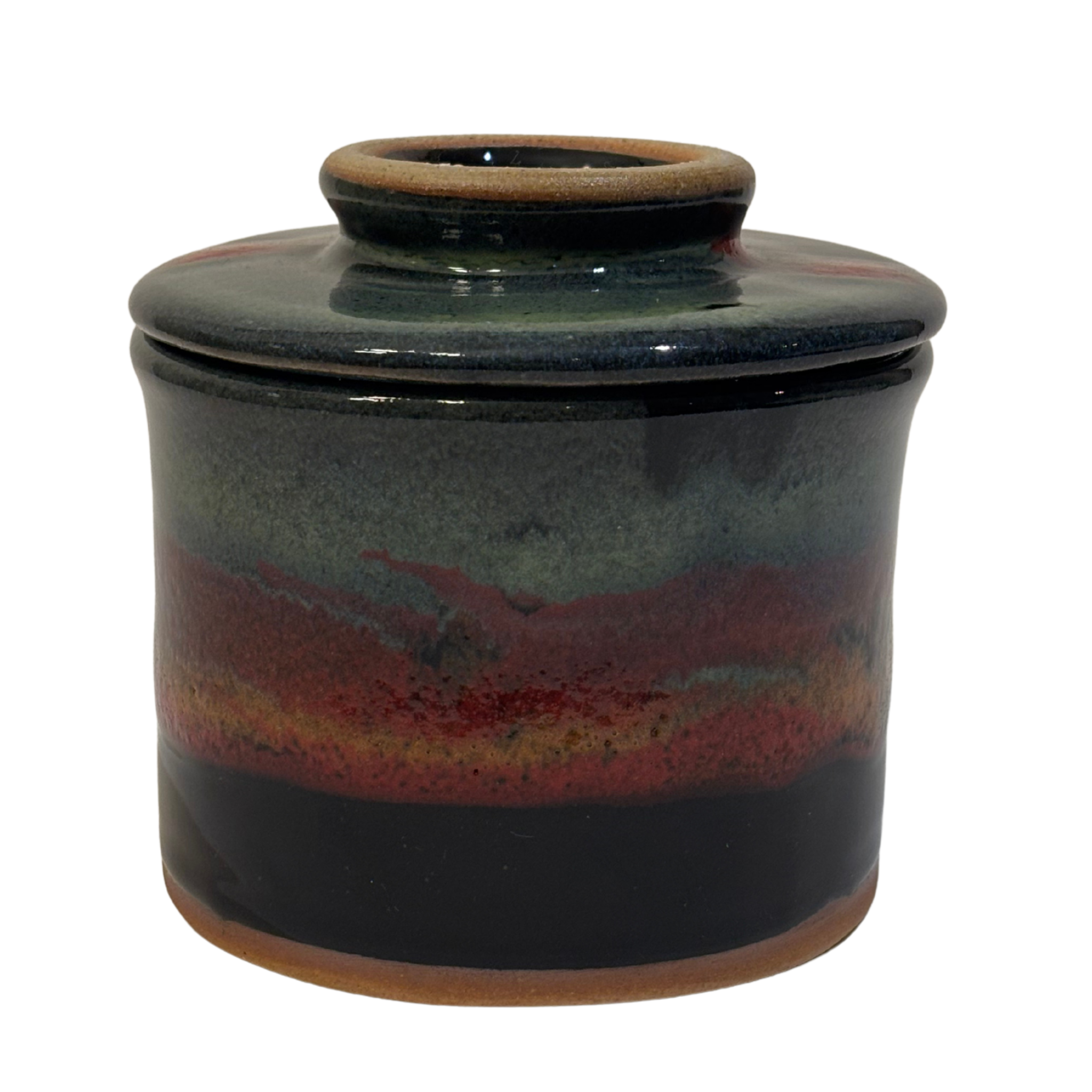 Handmade ceramic French butter press in Mountain Dusk glaze with green, red, and black tones