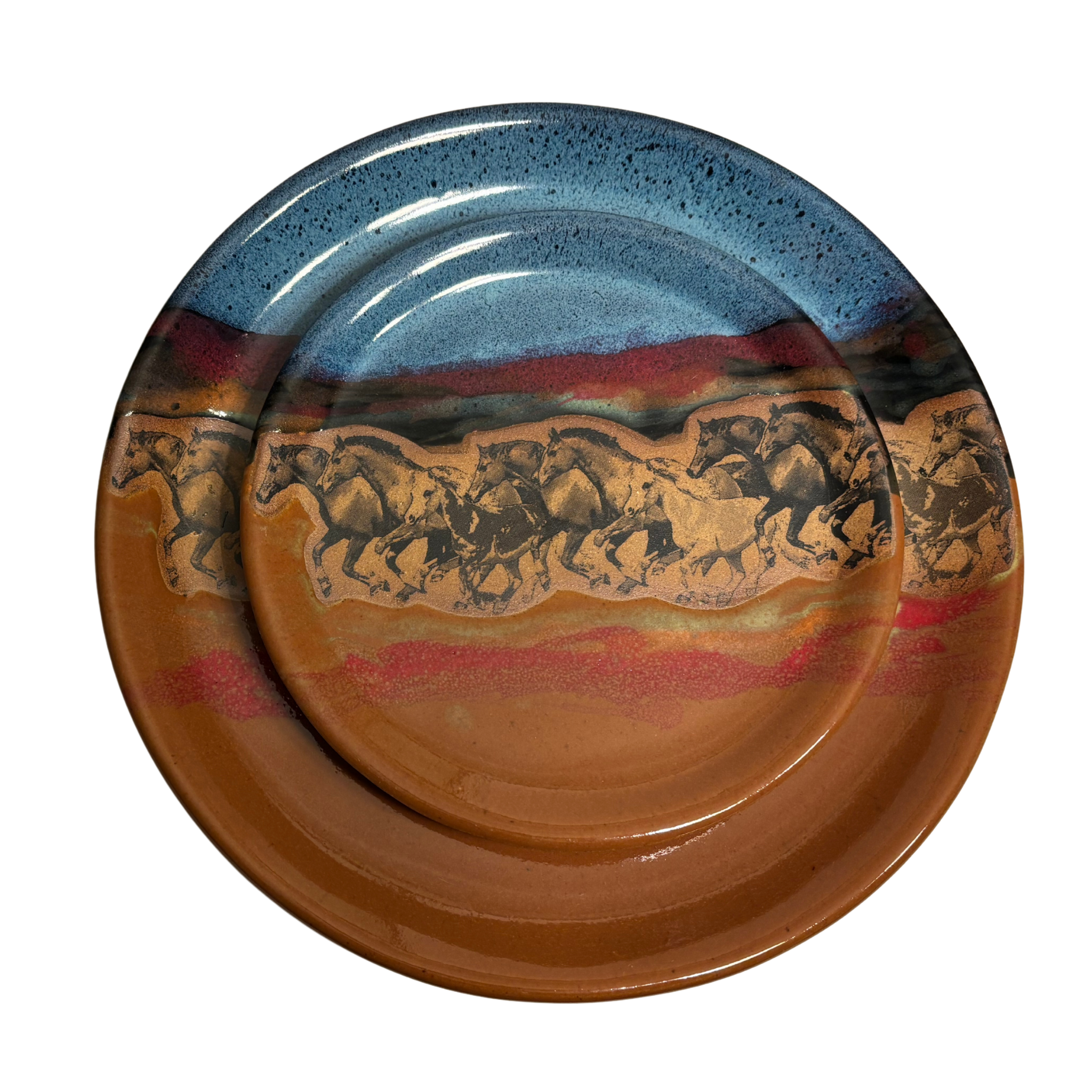 Handmade ceramic dinner and salad plates with running horse artwork and layered desert glaze.
