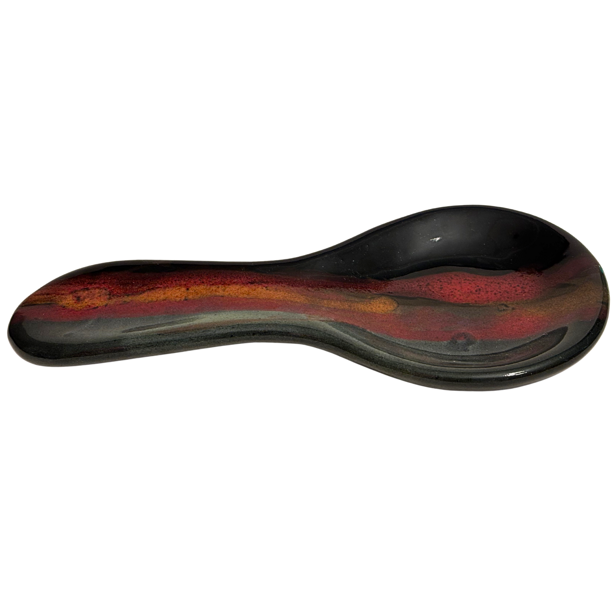 Handmade Jasper Wilderness ceramic spoon rest for kitchen counters, with black glaze, earthy red, and golden tones inspired by mountain sunsets.