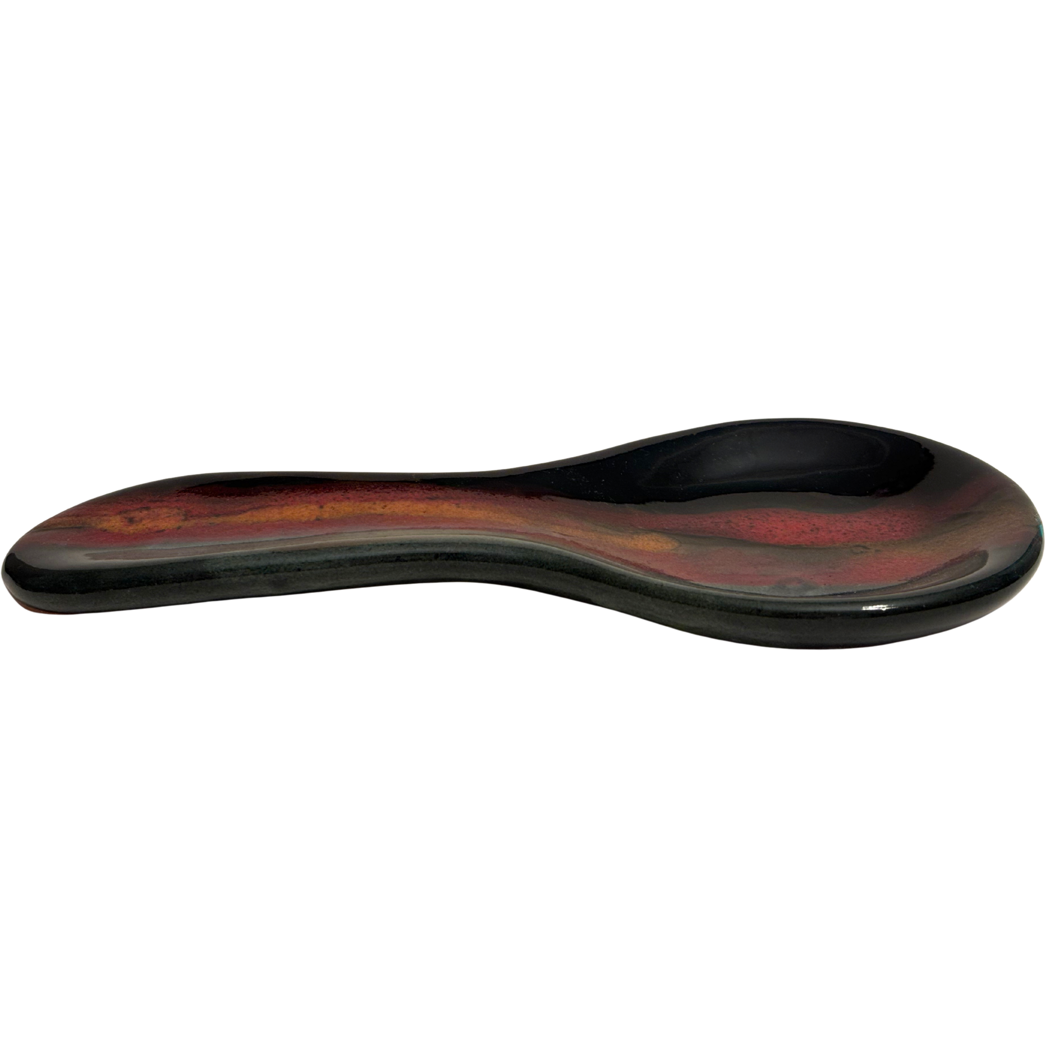 Handmade Jasper Wilderness ceramic spoon rest for kitchen counters, with black glaze, earthy red, and golden tones inspired by mountain sunsets.