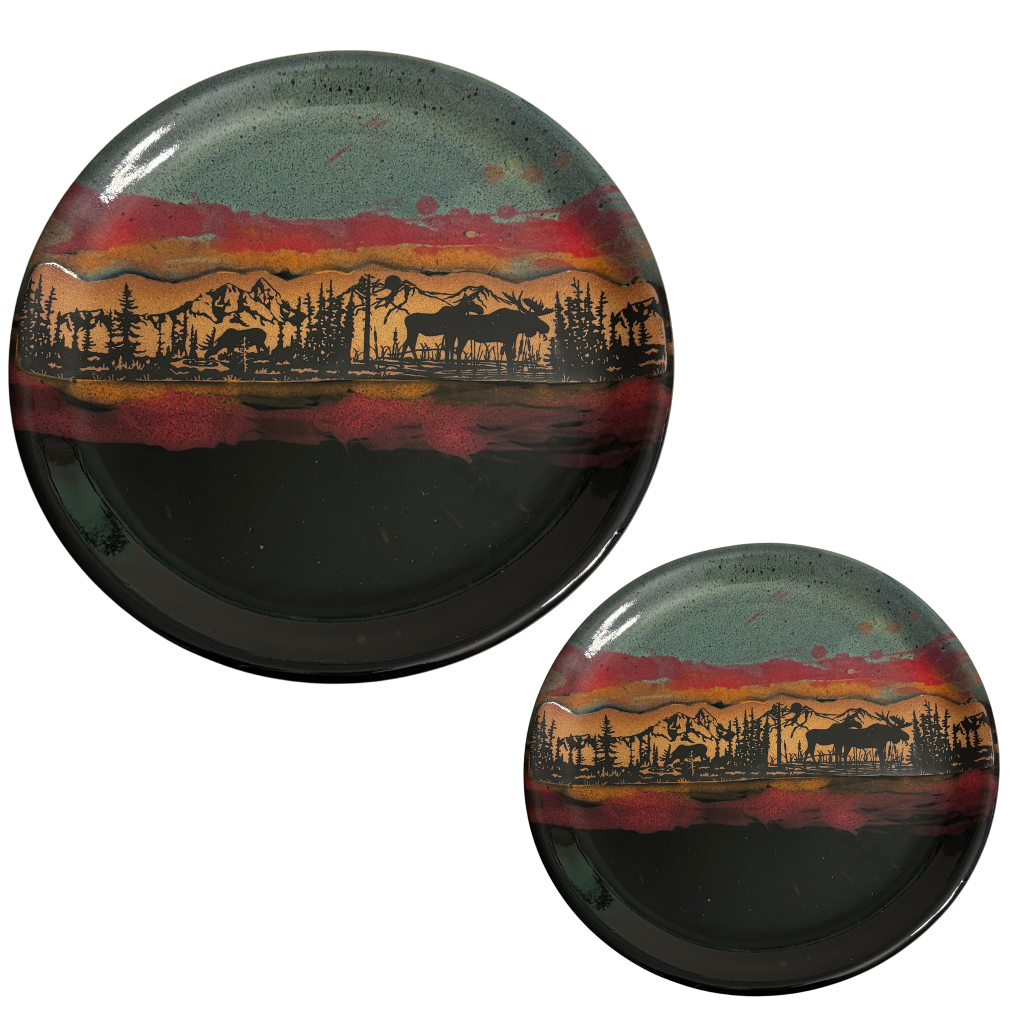 Jasper Wilderness Horizon handmade ceramic dinner & salad plates with forest, moose, and mountain silhouette on red, gold, and blue glaze.