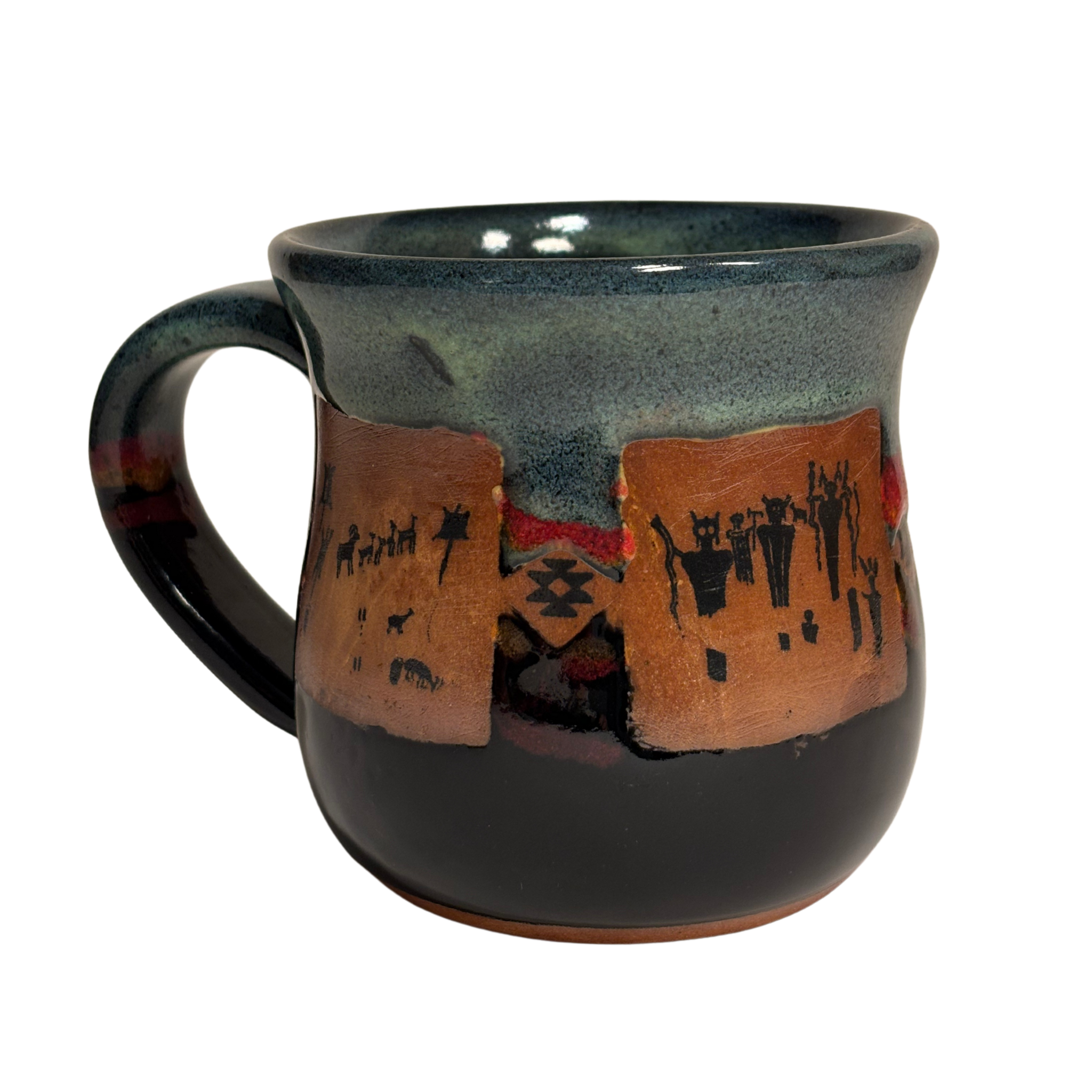 Handmade ceramic mug with tribal-style petroglyph artwork and black glaze