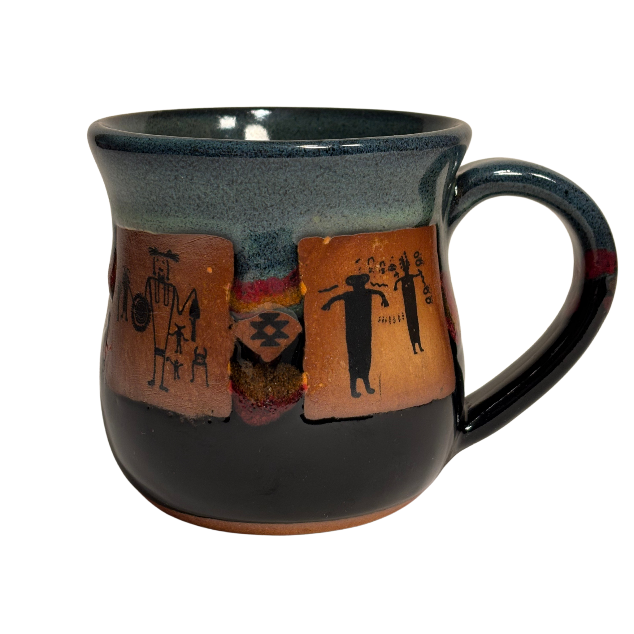 Handmade ceramic mug with tribal-style petroglyph artwork and black glaze