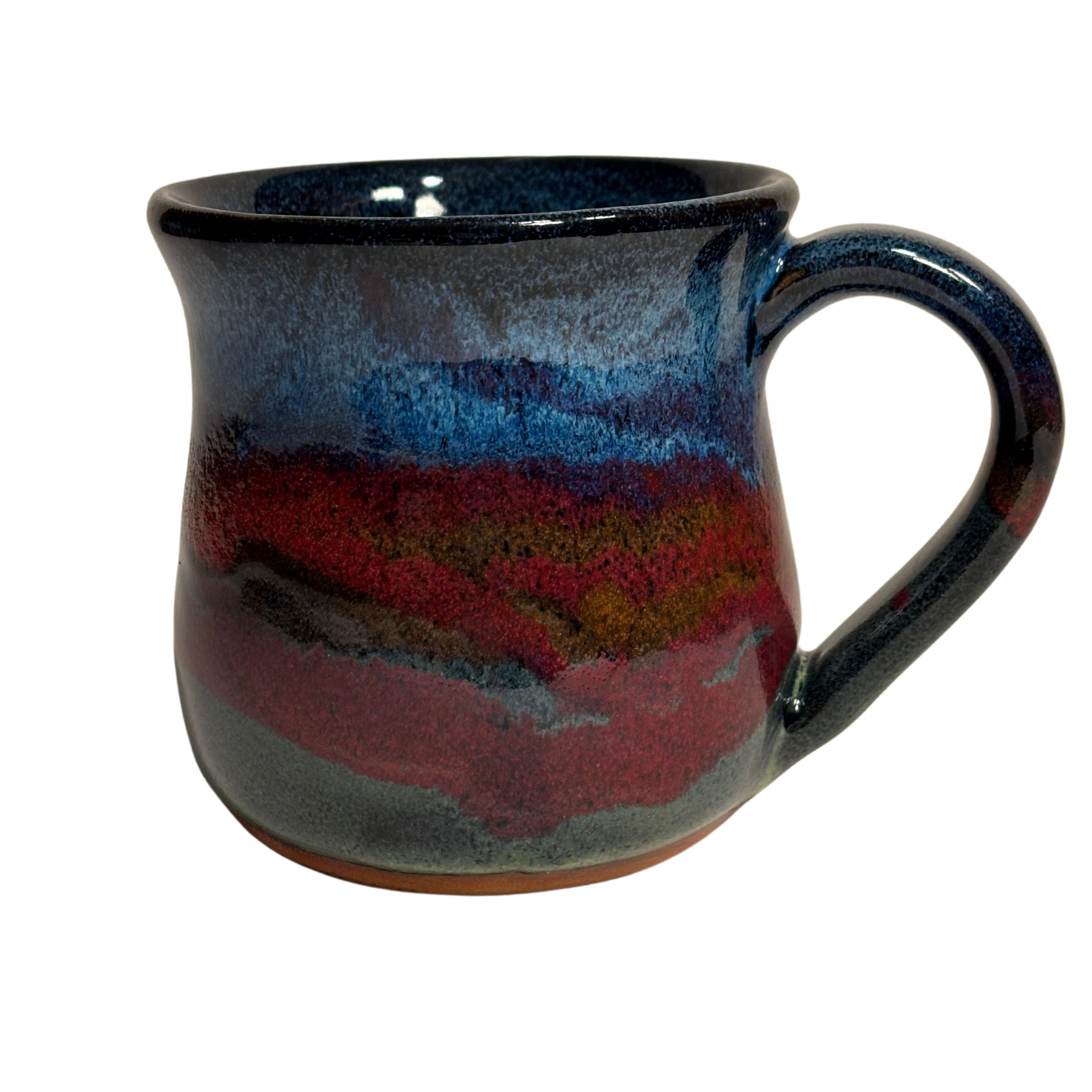 Handmade ceramic mug with deep mountain-inspired glaze in red, blue, and charcoal