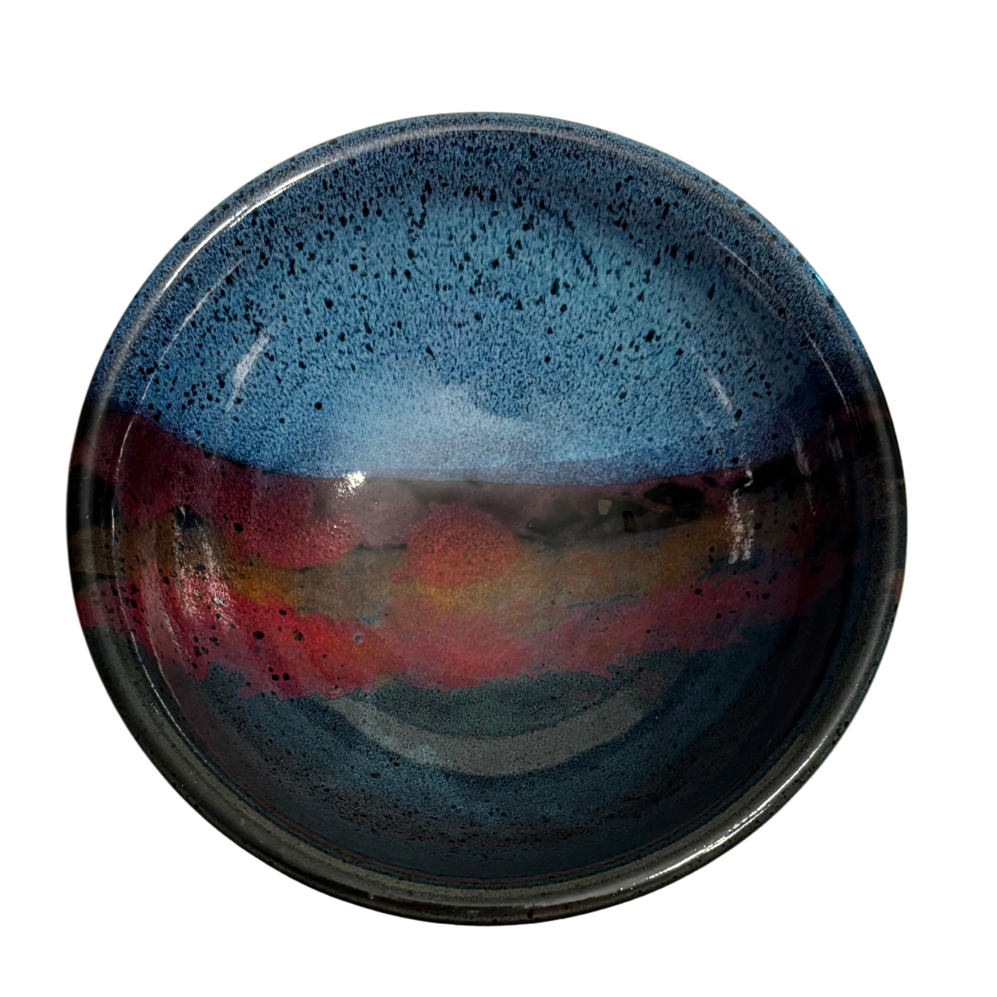 Mountain Dusk handmade ceramic salad bowl with deep blue interior and flowing red, brown, and purple glaze resembling dusk sky.